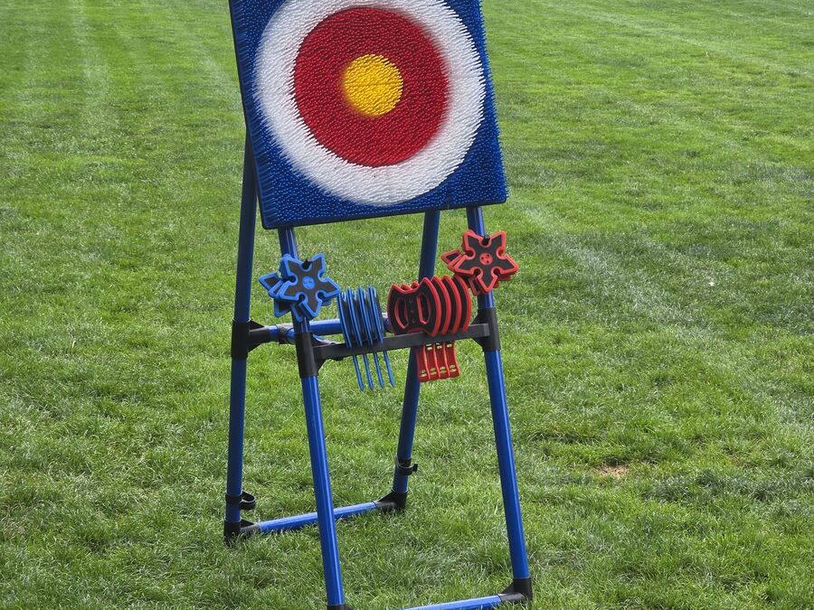 Backyard axe throwing lane set up on the lawn