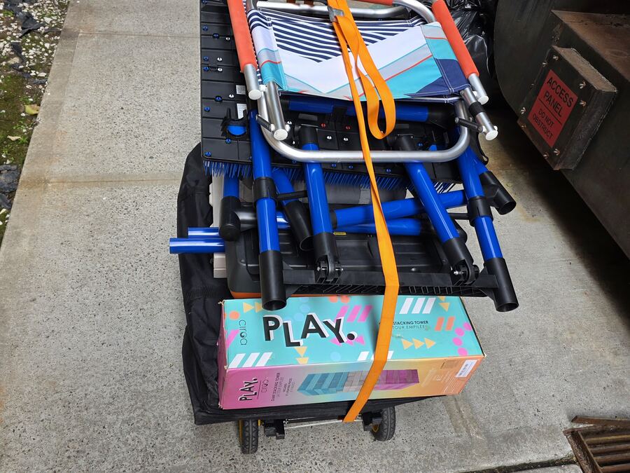 Rolling utility cart used to transport rental games